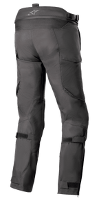 Pantalon Alpinestars Bogotá Pro Drystar® 4 Saisons - Long, pantalon de moto en textile noir, vue arrière mettant en évidence les sangles de réglage à la taille et aux mollets, coupe ergonomique pour la conduite d'aventure