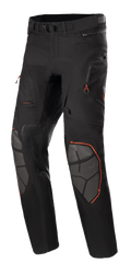 Alpinestars AMT-10R Drystar XF, pantalon de moto touring d'aventure, noir avec accents orange, renforts de genoux en Superfabric gris, ceinture réglable, poches zippées et design laminé imperméable