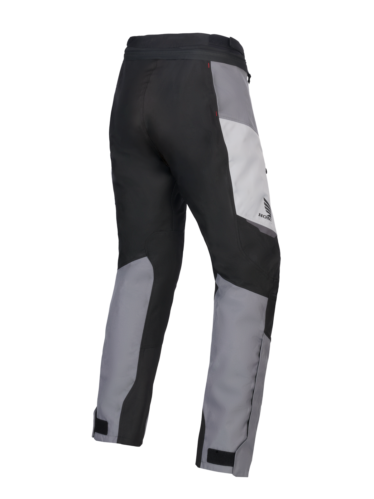 Pantalon Alpinestars 2025 Honda Stella ST-1 Waterproof pour femme, pantalon de touring moto, gris glace, gris foncé et noir, vue de trois-quarts arrière montrant la construction textile durable, les empiècements contrastés gris et noirs, le logo Honda sur la hanche et les pattes de serrage aux chevilles.