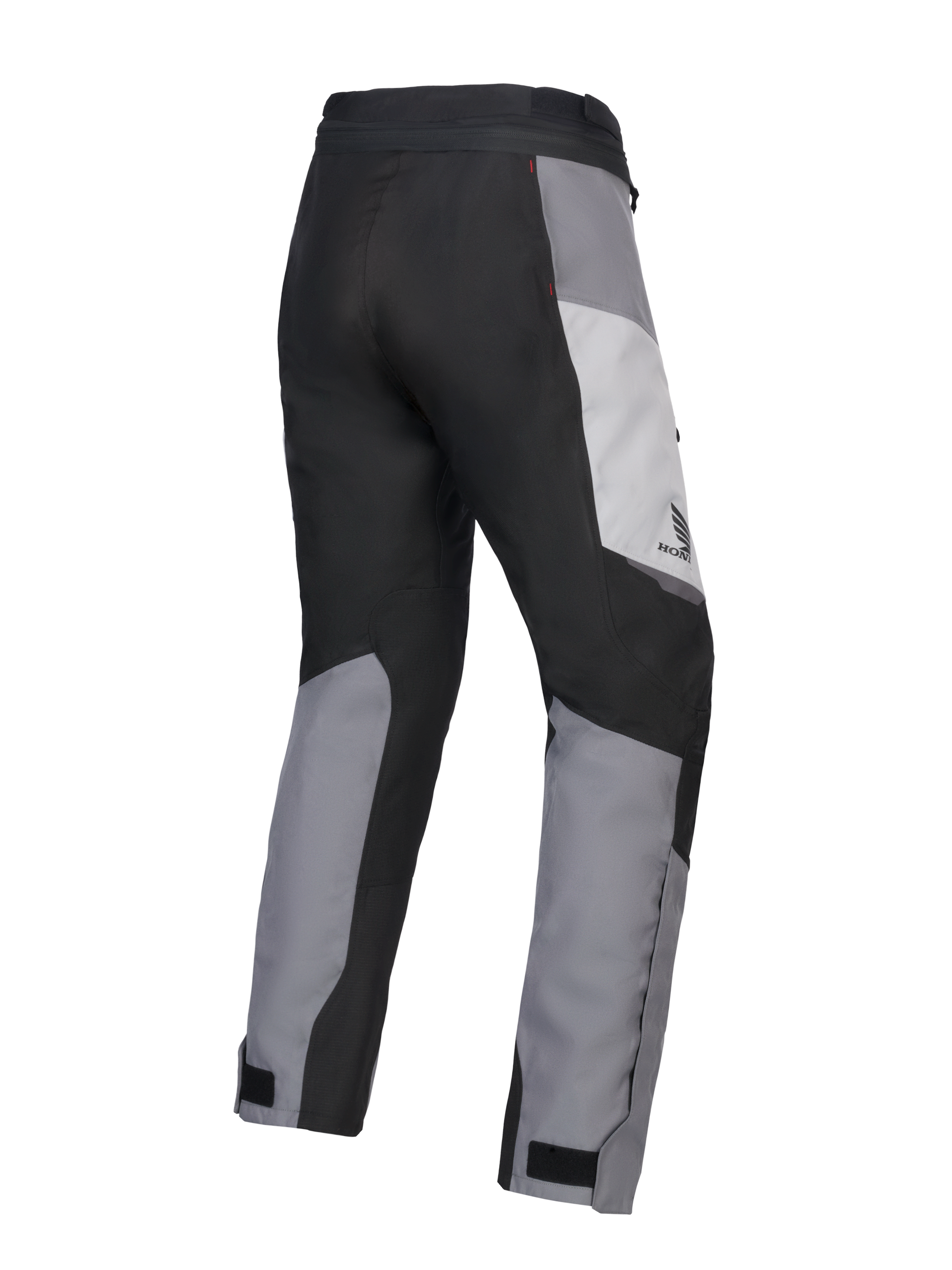 Pantalon Alpinestars 2025 Honda Stella ST-1 Waterproof pour femme, pantalon de touring moto, gris glace, gris foncé et noir, vue de trois-quarts arrière montrant la construction textile durable, les empiècements contrastés gris et noirs, le logo Honda sur la hanche et les pattes de serrage aux chevilles.