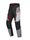 Pantalon Alpinestars Honda Stella ST-1 Waterproof pour femme, pantalon de touring moto, gris glacé, gris foncé et noir avec accents rouges, poches cargo zippées, construction textile ergonomique et taille réglable