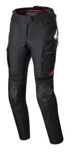 Women Stella Honda Andes V3 Drystar® Pants, textile motorcycle pants, Black with Bright Red accents, featuring Honda and Alpinestars branding, cargo pockets with red trim, reinforced knee panels, adjustable waist strap, and red interior lining at the waist