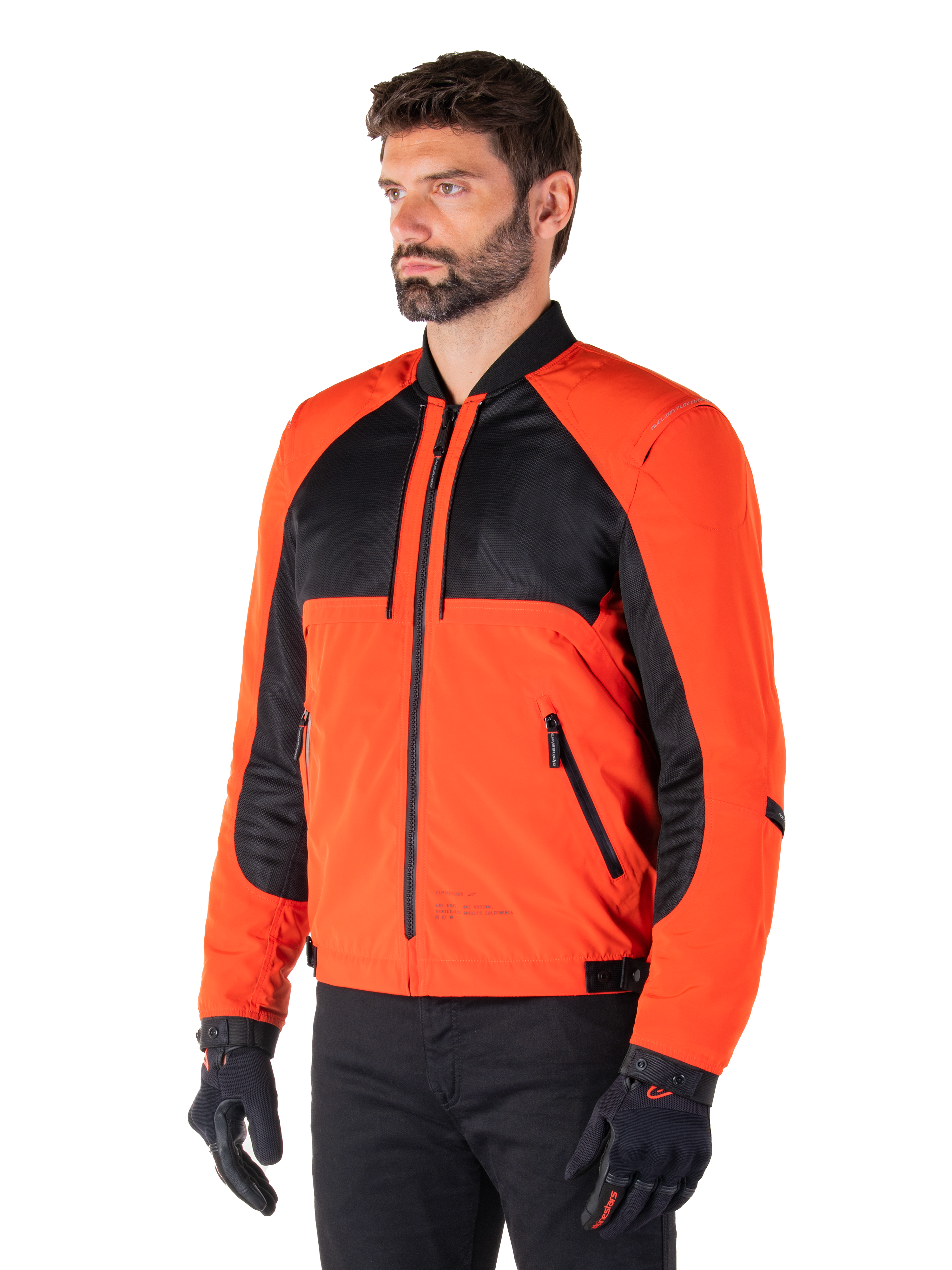 Alpinestars Mootant Waterproof Parka in Spicy Orange and Black, modular motorcycle jacket shown in its bomber configuration, features black mesh and orange textile panels, urban contemporary riding gear worn with black gloves