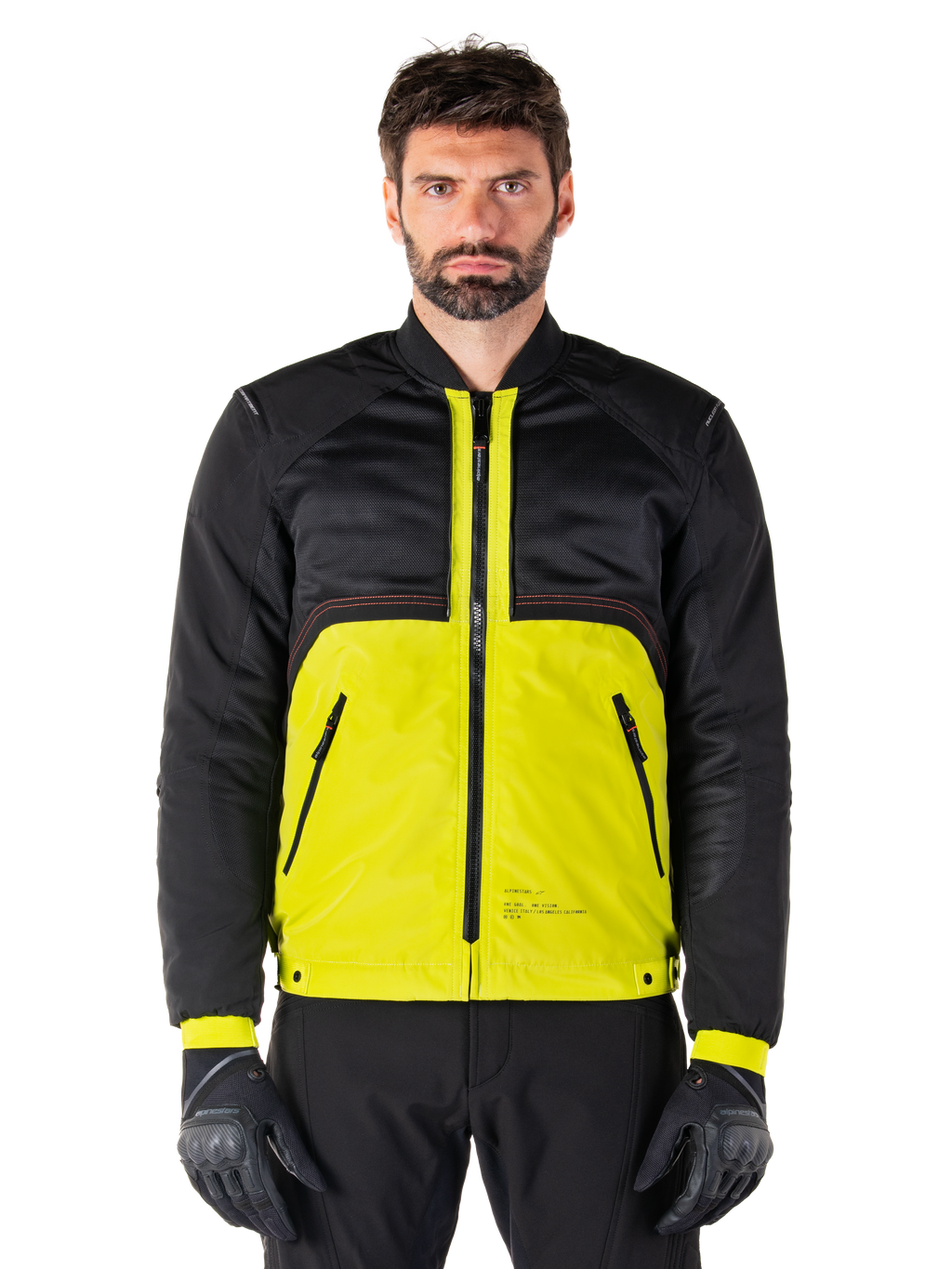 Parka imperméable Mootant, veste de moto modulaire, Lime Punch et noir, portée par un mannequin homme avec des gants et un pantalon noirs, présentant un bas de corps jaune vif ainsi qu'un buste et des manches noirs, design utilitaire pour rouler par tous les temps