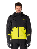Alpinestars Mootant Waterproof Parka, veste de moto touring, noir et jaune Lime Punch, design bicolore à capuche avec partie inférieure jaune vif et corps supérieur noir, sangles jaunes aux manches, logo sur la poitrine, style technique modulaire