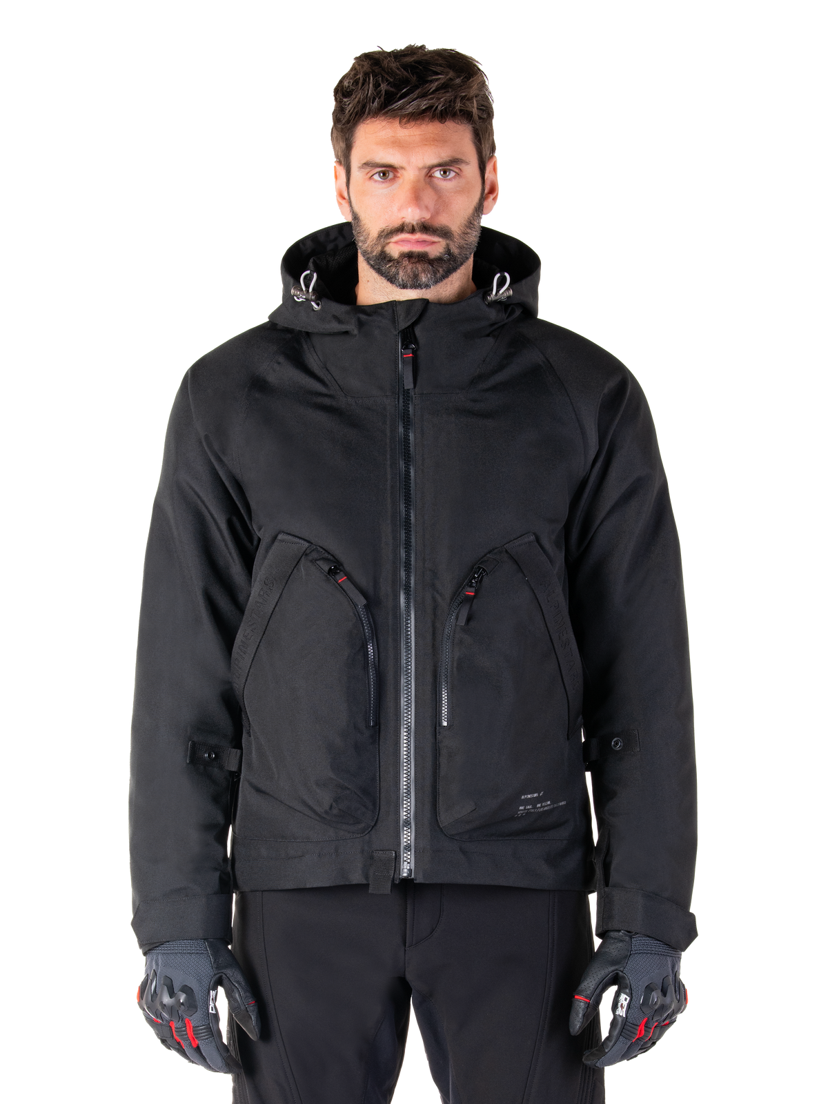 Alpinestars Morush Waterproof Parka, veste de moto urbaine noire pour homme avec capuche et grandes poches zippées.