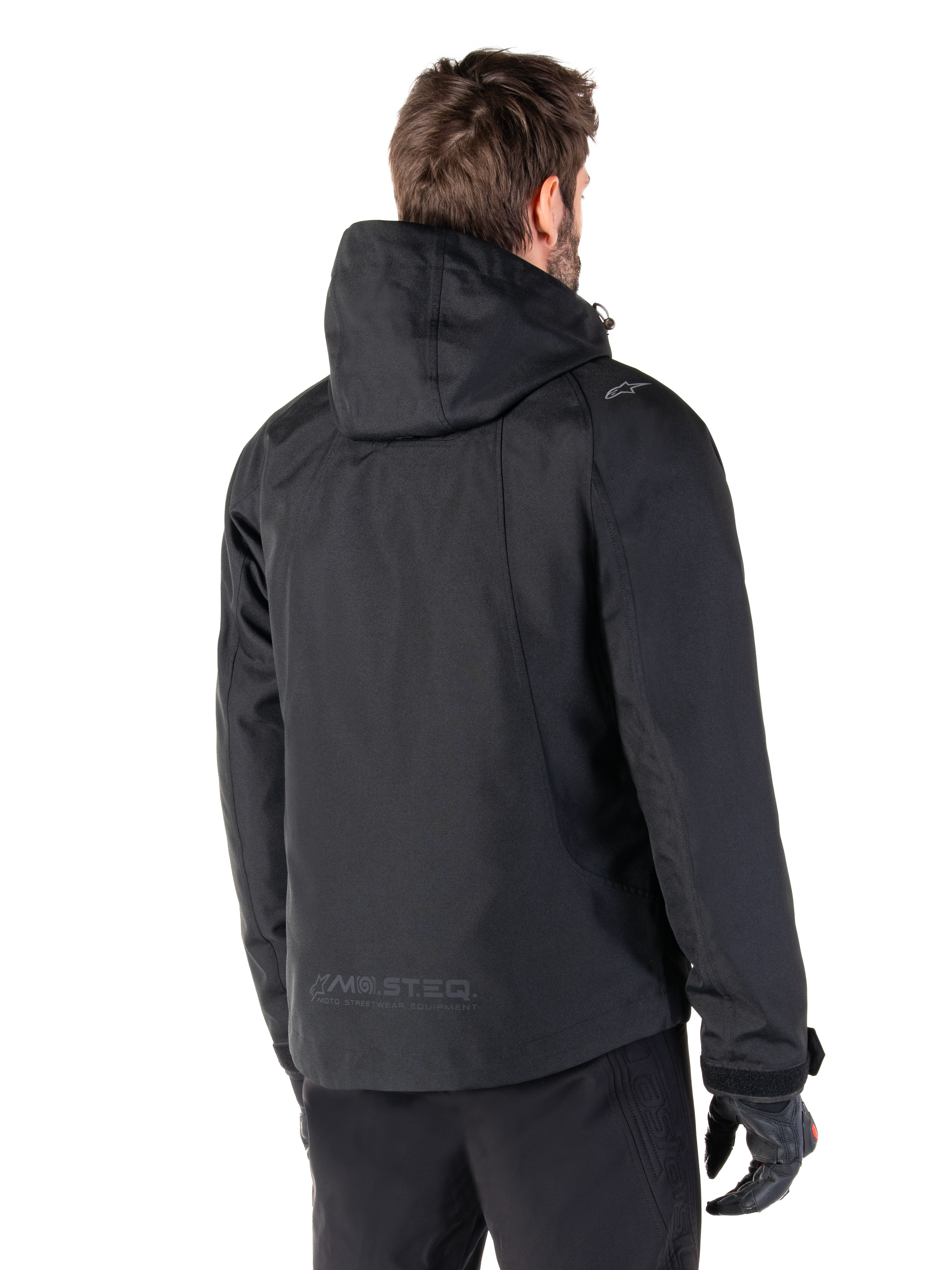 Parka imperméable Alpinestars Morush, veste de moto urbaine noire pour homme, vue de dos à capuche avec marquage MO.ST.EQ.