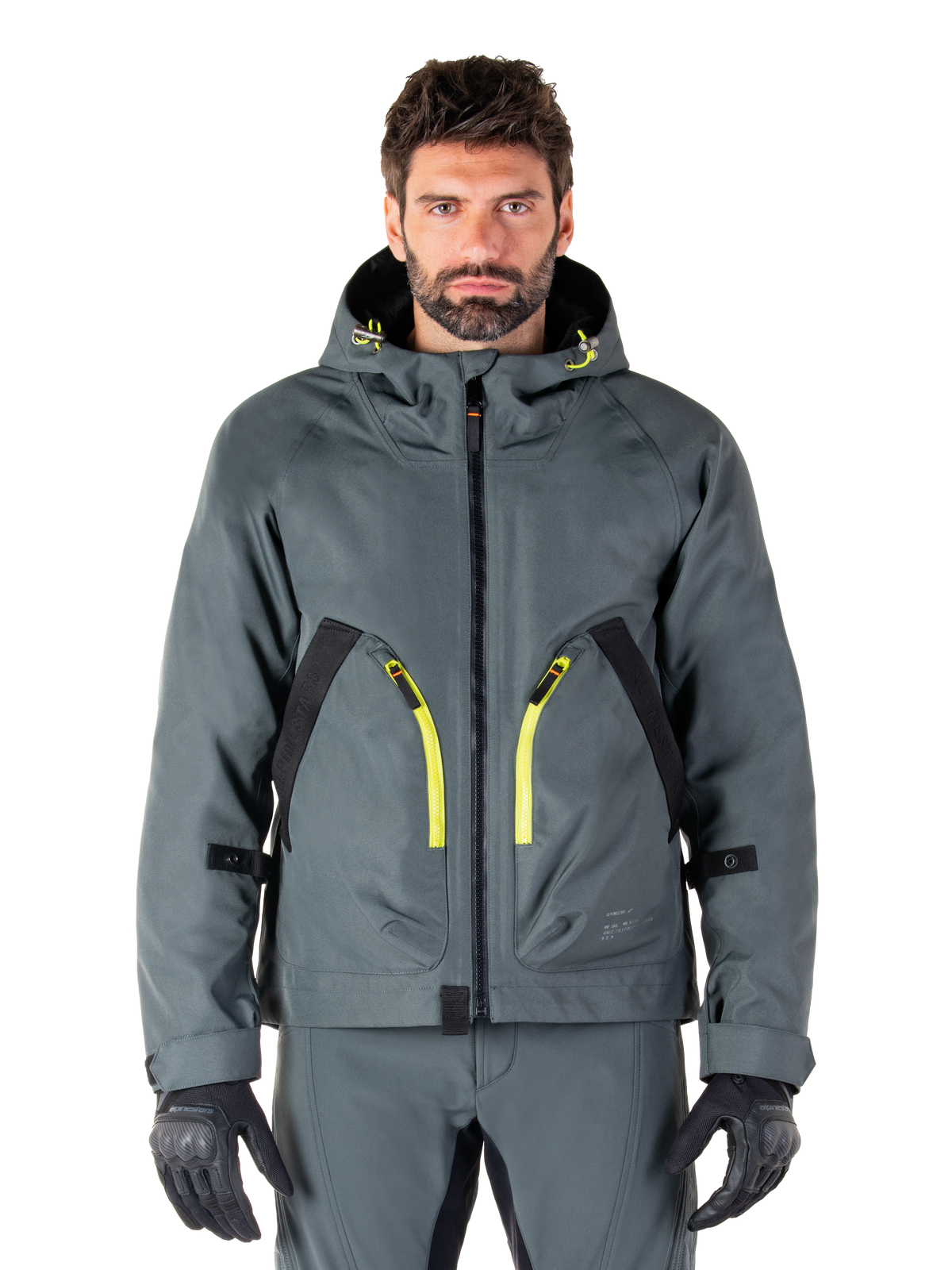 Alpinestars Morush Waterproof Parka, veste de moto gris urbain, fermetures éclair jaune vif et accents noirs, modèle à capuche avec de grandes poches avant, style technique inspiré du streetwear