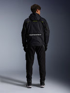 Alpinestars Mogress Air Jacket, urban motorcycle jacket, back view in black with lime punch and white accents, featuring Alpinestars branding across the lower back, worn with black pants and boots.