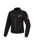 Veste Alpinestars Stella Grace, veste de moto pour femme, noire, design d'inspiration workwear urbain avec plusieurs fermetures éclair à l'avant, col à bouton-pression, logo Alpinestars cuivré et écusson vintage en spirale sur la manche.
