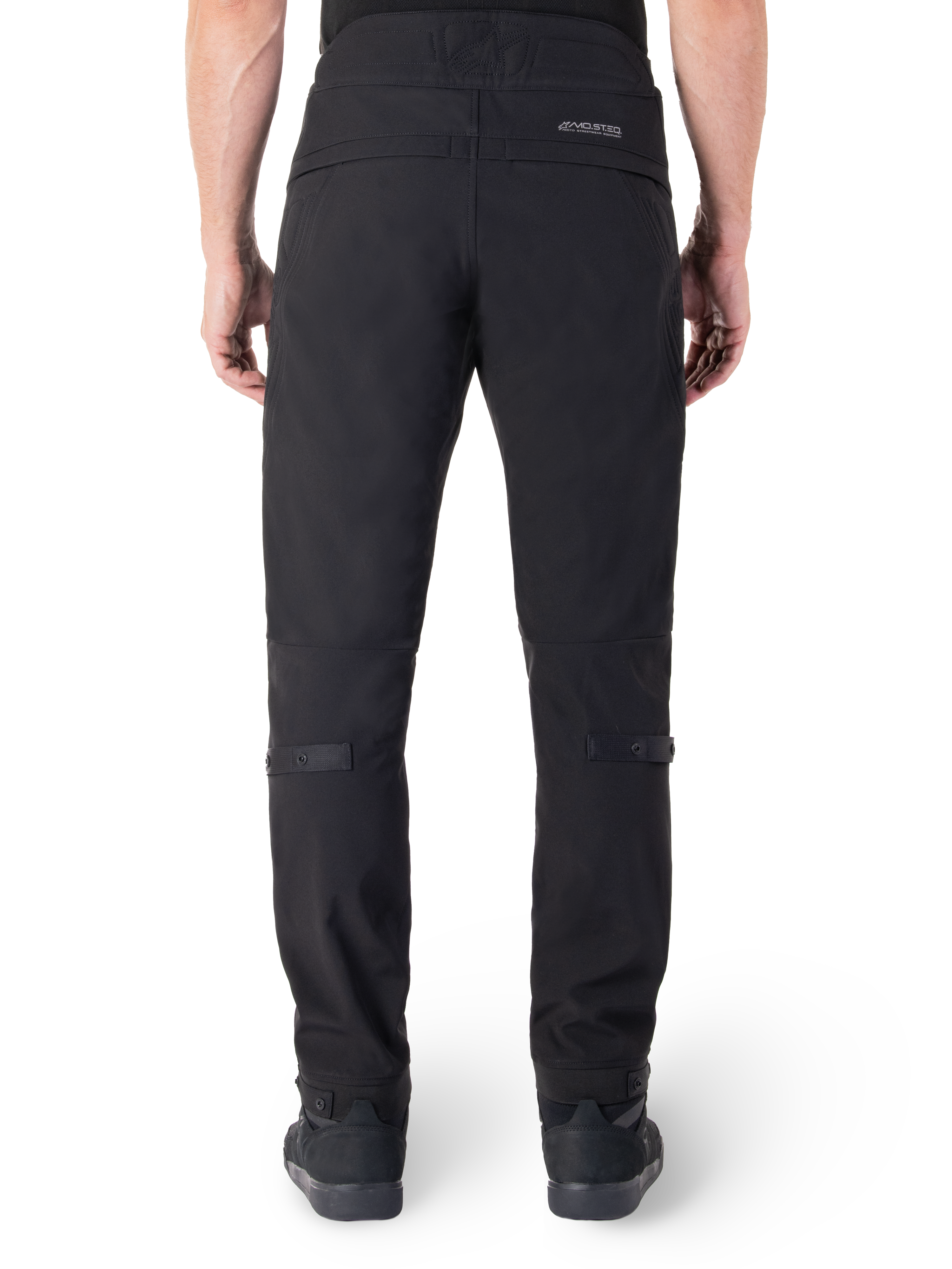Alpinestars Alden Pants, Black Urban Motorcycle Pants, rear view, featuring reflective MO.ST.EQ. wordmark on the back yoke, slim fit below the knee, and snap button volume adjusters on the calves and cuffs, streetwear-inspired technical textile design.