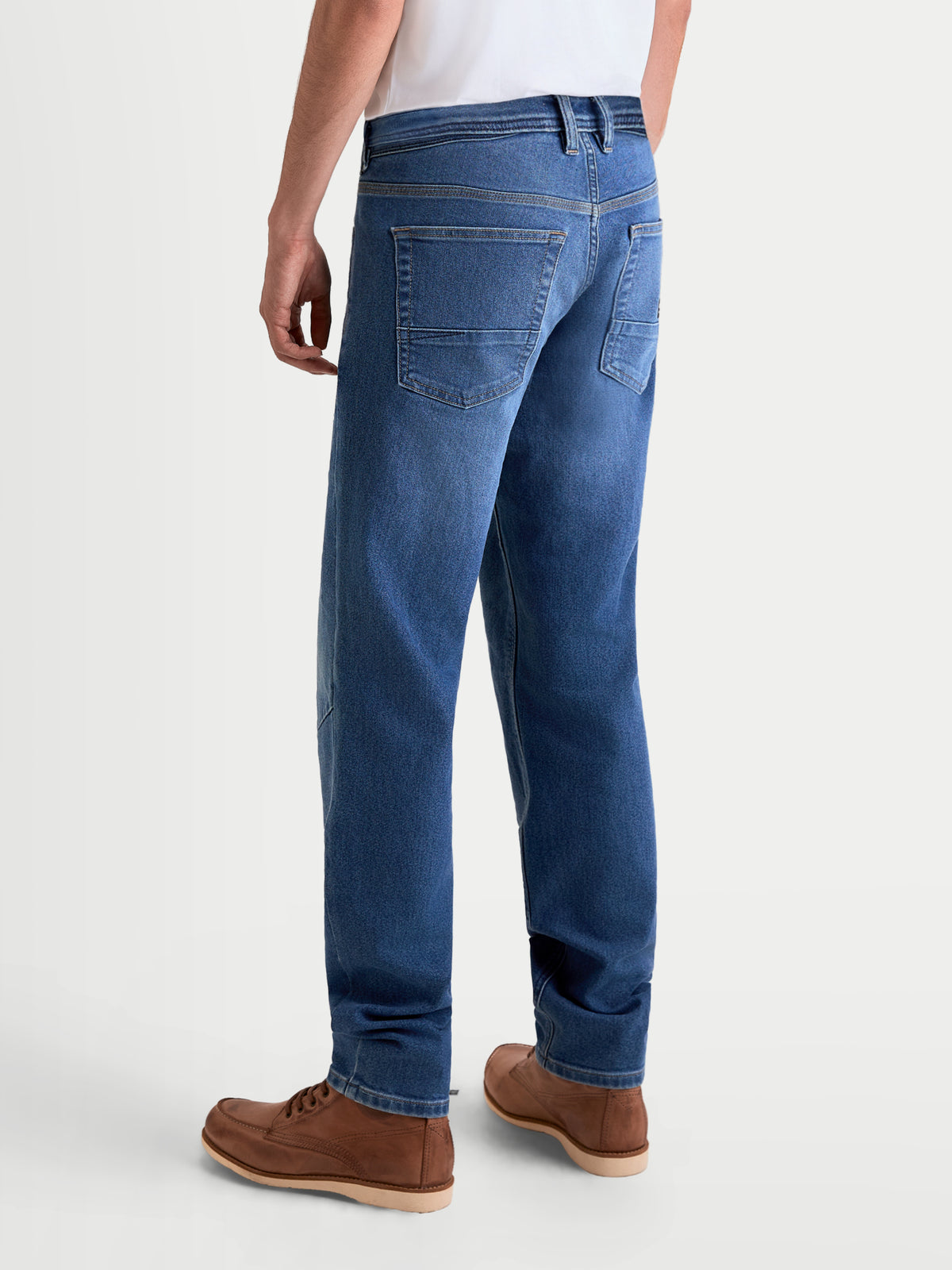 Alpinestars Flex-AST 7 Denim Pants, men's urban motorcycle riding jeans in light blue, rear view showing single-layer technical denim construction and five-pocket layout worn by a model.