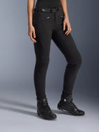 Alpinestars Alamosa Women Pants, Black Urban Motorcycle Pants, slim-fit design with zippered pockets and integrated waist belt, paired with black high-top riding shoes
