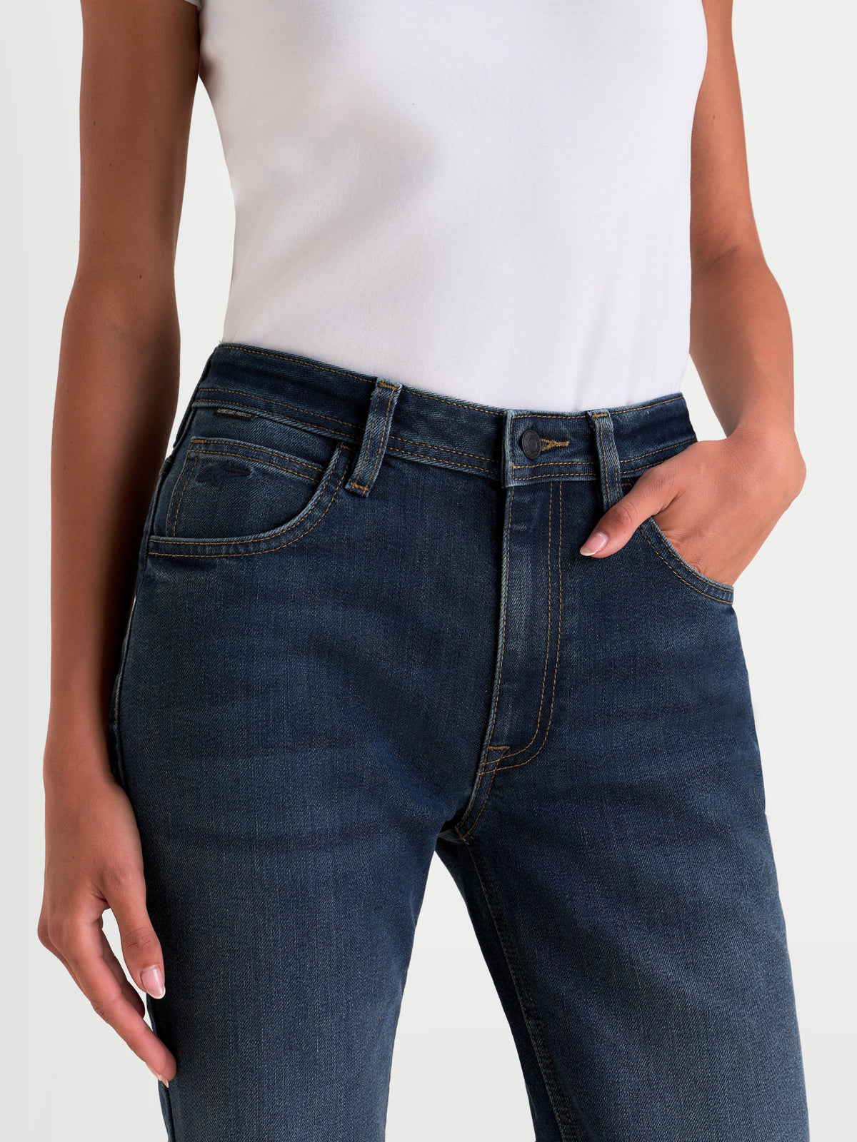 Alpinestars Stella Flex-AST 5 Denim Pants Short, women's urban motorcycle riding jeans, indigo washed blue, close-up shot showing waist and pocket details worn by a model