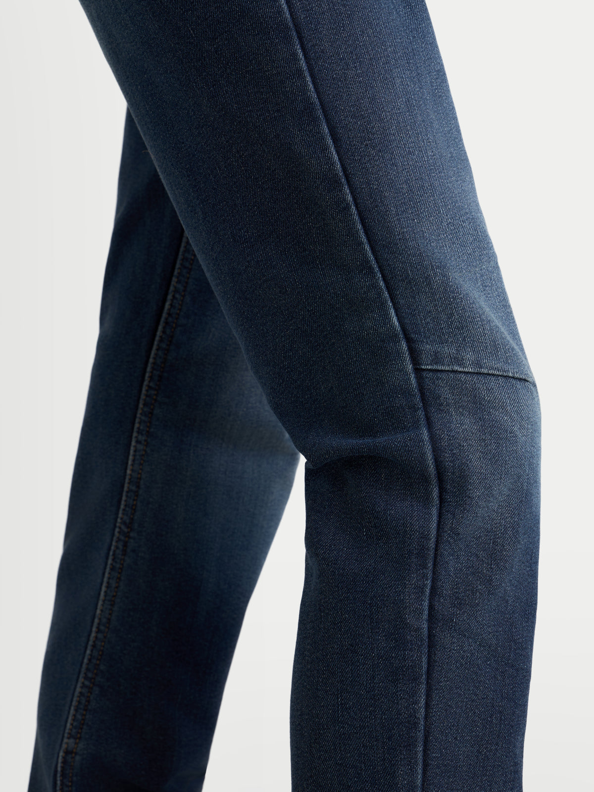 Alpinestars Stella Flex-AST 5 Denim Pants Short, women's urban motorcycle riding jeans, indigo washed blue, single-layer tech denim construction, close-up view showing knee area and flexible protection