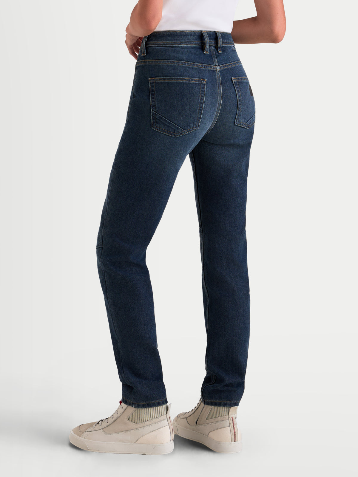 Alpinestars Stella Flex-AST 5 Denim Pants Short, women's urban motorcycle riding jeans in indigo washed, rear view showing single-layer Tech Denim construction, raised rear waistband, and slim fit worn by a model.