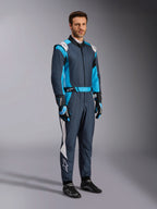 Alpinestars GP Pro Comp V2 FIA Suit, professional auto racing gear in Asphalt and Cyan, worn by a man.