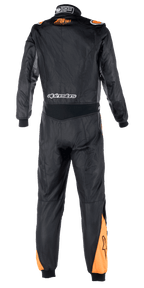 Alpinestars Atom FIA Graphic Suit, back view of a one-piece auto racing suit, Black and Anthracite with Orange Fluo accents on shoulders and calves, featuring FIA certification details on the collar and Alpinestars branding across the lower back.