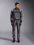 Alpinestars KMX-9 V3 Graphic 5 Suit, Karting Suit, Dark Gray and Black with camouflage-style graphics, featuring a black chest band with white logo and a red waist belt accent, worn with matching racing gloves and shoes, professional motorsport gear