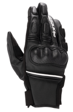 Gants en cuir Alpinestars Phenom, noir et blanc, gants de moto à manchette courte avec protection rigide des articulations, détails en cuir perforé, logo Alpinestars blanc sur l'index et liseré blanc au poignet