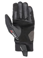 Gants Alpinestars Hyde XT Drystar® XF, gants de moto, noir et rouge vif, vue de la paume montrant la construction en daim synthétique renforcé, marquage Drystar XF Extra Flow sur le pouce et rabat de fermeture réglable au poignet.