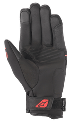 Gants Alpinestars Syncro V2 Drystar®, Noir et Rouge Fluo, vue de la paume montrant la construction en daim synthétique, paume rembourrée pour la protection, sangle de poignet réglable avec logo rouge et marquage Drystar®.