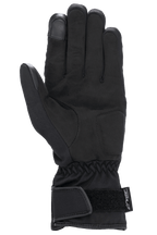 Gants Alpinestars Stella SR-3 V2 Drystar® pour femme, noirs, vue de la paume montrant les renforts en cuir synthétique, bout de l'index compatible avec les écrans tactiles, poignet élastiqué et manchette avec sangle Velcro réglable et logo Drystar.