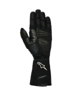 Alpinestars Tech-M V2 Gloves FIA, gants pour équipe de stand, noir et blanc, vue de la paume montrant le cuir texturé et les patchs d'adhérence en silicone, logo étoile blanc sur le poignet élastiqué, conçus pour l'utilisation de pistolets à roue en sport automobile