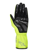 Gants Alpinestars Tech-1 K Race V2 Pure, gants de karting, jaune fluo et noir, vue de la paume montrant un motif d'adhérence en silicone à points blancs, logo Alpinestars gris et texte 'ONE GOAL' sur la manchette, équipement de sport automobile professionnel