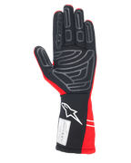 Gants Alpinestars Tech-1 Start V4 FIA, gants de course automobile, rouge et noir, vue de la paume avec motifs d'adhérence en silicone gris, logo Alpinestars blanc sur la manchette longue et étiquette de certification FIA 8856-2018