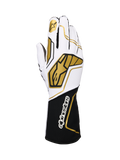 Alpinestars Tech-1 KX V4 Gloves, karting racing gloves, white and black with gold accents, featuring a gold star logo on the index finger and large gold geometric patterns on the back, breathable mesh construction with a black cuff and white branding, ergonomic design for motorsport performance.