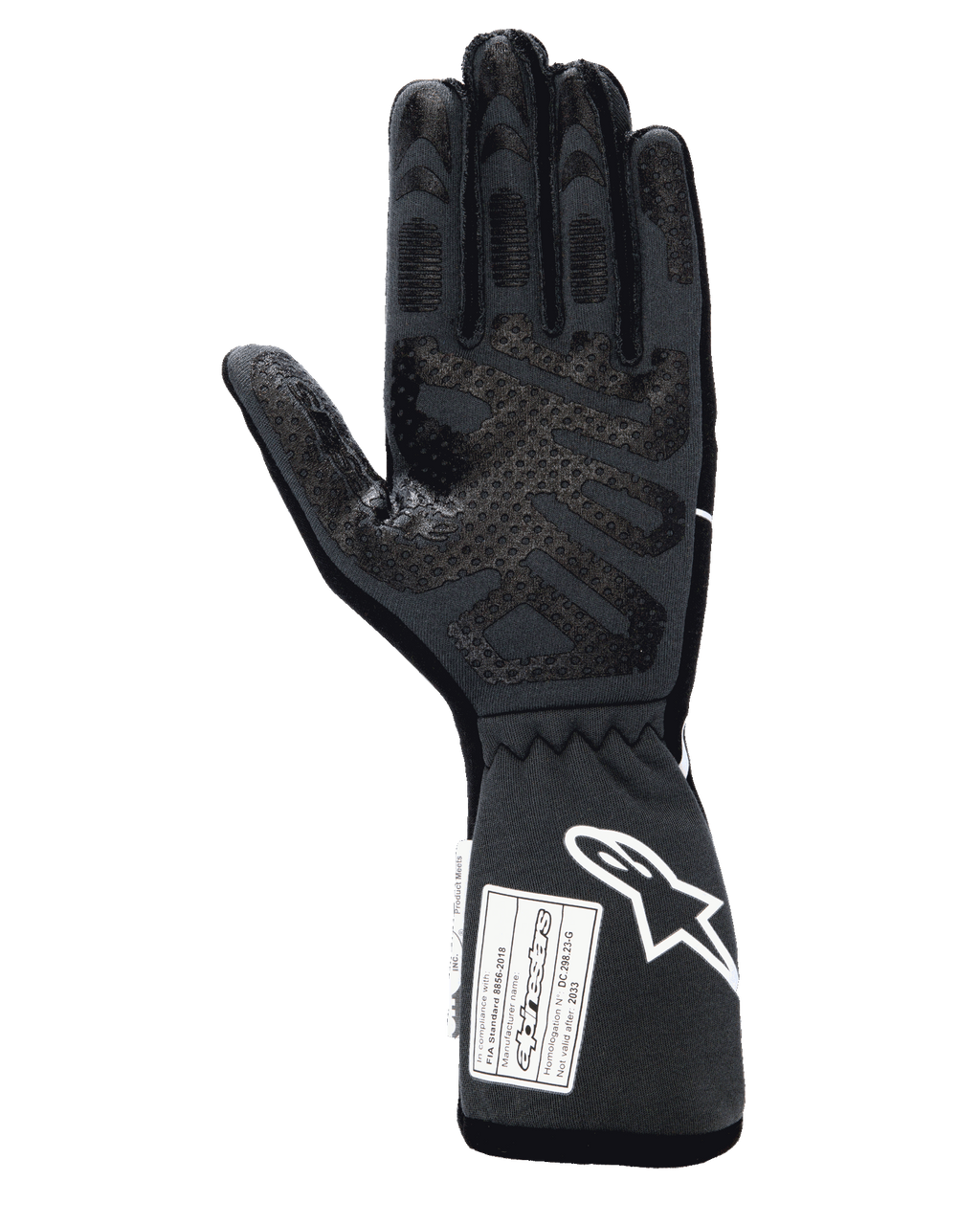 Gants Alpinestars Tech-1 Race V4, gants de course automobile professionnels, noir tar gray, vue côté paume avec motifs d'adhérence en silicone étendus sur les doigts et la paume, manchette étendue avec logo Alpinestars blanc et étiquettes d'homologation FIA/SFI