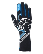 Alpinestars Tech-1 Race V4 Gloves, Auto Racing Gloves, Black with Blue and White accents, featuring a large white logo on the backhand, blue finger piping, and extended gauntlet cuff, professional flame-resistant design for motorsport