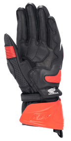 Gants Alpinestars Honda GP Pro R3, gants de sport racing à manchette longue, noir et rouge vif, vue de la paume avec protège-manchette rigide rouge, slider de paume et logo Honda, équipement de course moto professionnel