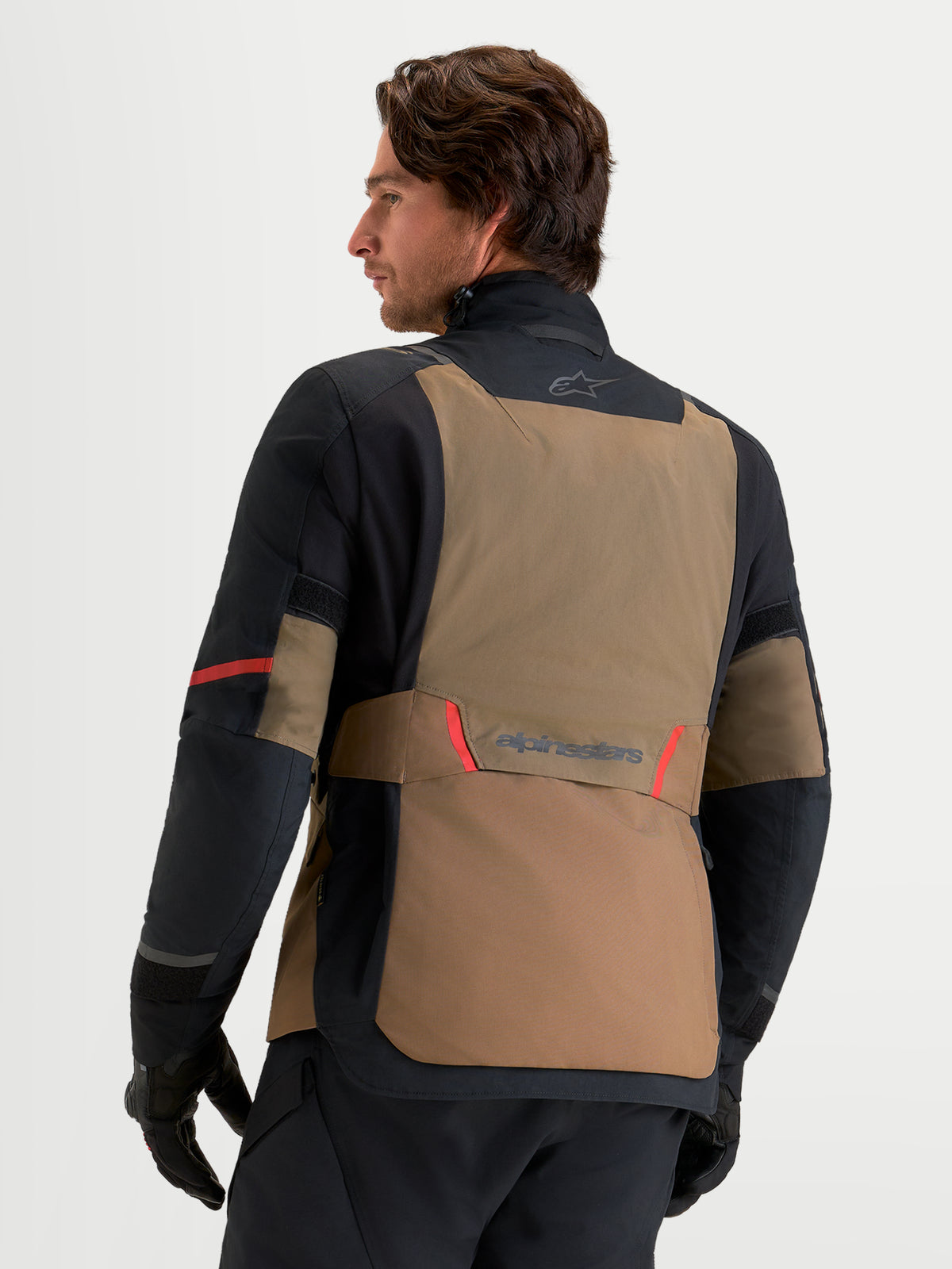Alpinestars St-7 V2 2L Gore-Tex Jacket, Men's Adventure Touring Motorcycle Jacket, Walnut and Black, featuring a waterproof laminated GORE-TEX shell, rear view on a model