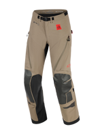 Alpinestars Nazca 3L GORE-TEX PRO Pants, Adventure Motorcycle Pants, Walnut and Black, featuring a red All Terra logo patch, GORE-TEX PRO branding, black Superfabric knee and shin reinforcements, zippered thigh ventilation, and an integrated belt with a magnetic buckle.