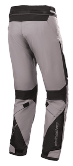 Alpinestars Road Pro GORE-TEX Pants, Motorcycle Touring Pants, Dark Gray and Black, rear view featuring technical textile construction, black ballistic nylon reinforcements, adjustable straps at the knees and ankles, and Alpinestars branding.