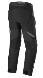 Pantalon Alpinestars ST-7 2L GORE-TEX, noir et gris foncé, vue arrière, pantalon de moto touring aventure imperméable avec empiècements renforcés, logo GORE-TEX sur le bas de la jambe et sangles de réglage aux chevilles