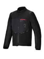 Alpinestars Pro-Dura Jacket, veste de moto tout-terrain, noire, textile ripstop durable, logo Alpinestars rouge sur la poitrine, poches zippées en biais et détails de logo étoile sur les épaules