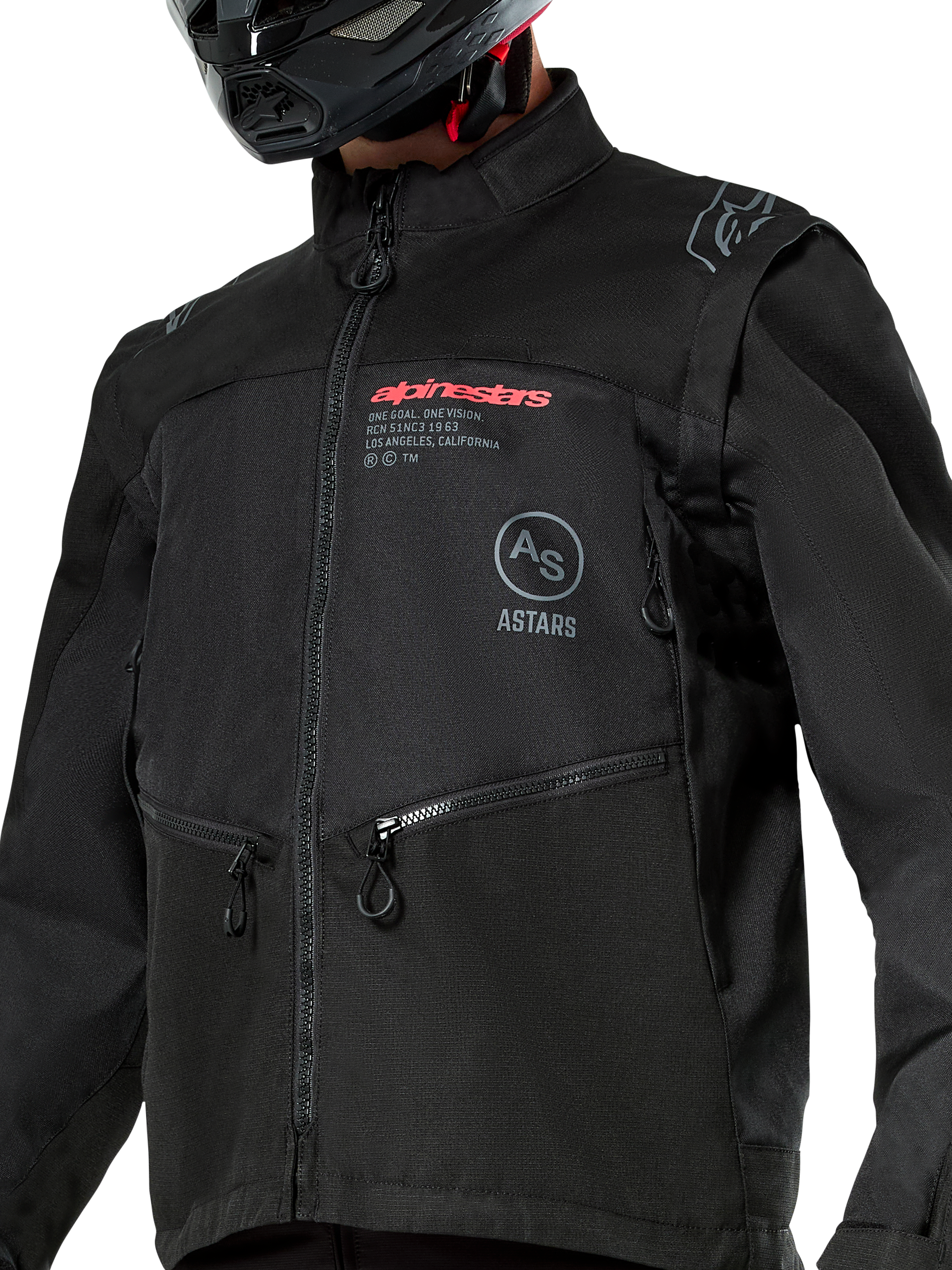 Veste Alpinestars Pro-Dura, veste de moto tout-terrain noire avec marquage Alpinestars rouge et logo Astars circulaire gris sur la poitrine, poches zippées et construction en textile ripstop robuste, design inspiré du rallye pour la pratique de l'enduro.