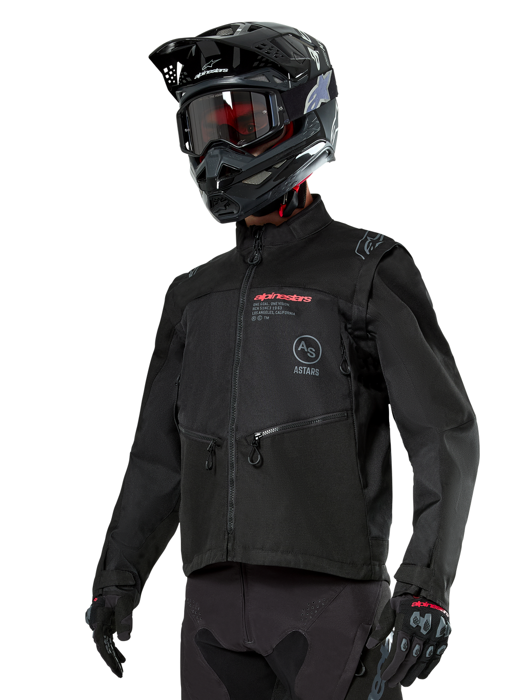 Alpinestars Pro-Dura Jacket, veste de moto tout-terrain, noire avec logos rouges et gris, dotée de poches avant zippées et d'un col montant, portée avec un casque de motocross noir et des gants pour l'enduro