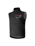 Gilet Softshell Alpinestars Youth Techstar, noir, gilet de motocross sans manches avec logo étoile rouge, col haut, fermeture éclair frontale, inscription "ONE GOAL. ONE VISION.", doublure intérieure gris clair, équipement de sport mécanique pour jeunes