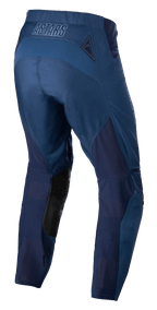 Alpinestars Techstar Phantom Pants, pantalon de motocross, bleu foncé, vue arrière avec panneaux en maille respirante et empiècements en cuir noir à l'intérieur des jambes, logo ASTARS sur la taille, conçu pour les performances tout-terrain
