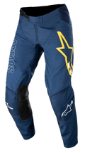 Alpinestars Techstar Phantom, pantalon de motocross, bleu foncé avec accents jaunes et blancs, panneaux de genoux en cuir noir, grand logo étoile jaune sur la cuisse, marquage ASTARS blanc, tissu rip-stop extensible durable pour le tout-terrain