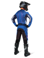 Alpinestars Pro-Dura Pants, Motocross and Enduro Pants, Navy Bright Blue White, back view, worn with matching blue jersey, black helmet, and black Tech boots, durable construction with stretch inserts for off-road riding