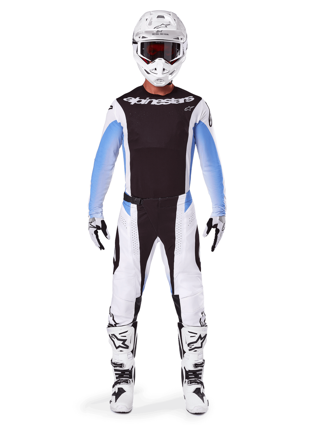 Pilote de motocross portant le pantalon Alpinestars Techstar Melt 2025, pantalon de motocross, noir et bleu, design multi-panneaux blanc et noir avec des accents bleus sur les hanches, porté avec un maillot blanc assorti, un casque blanc, des gants blancs et des bottes pour un équipement de course tout-terrain complet