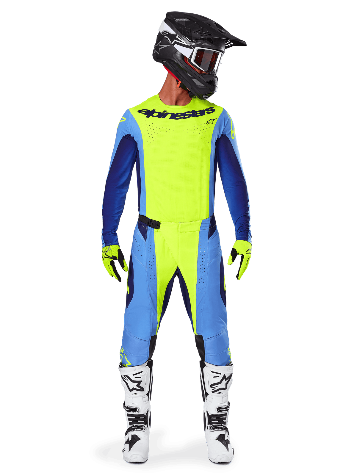 Pilote de motocross portant l'ensemble d'équipement Alpinestars Techstar Melt 2025, maillot jaune fluo avec manches bleues et bleu marine, pantalon assorti jaune et bleu, casque noir et blanc avec lunettes, bottes blanches et noires, gants jaunes et noirs, tenue coordonnée pour la course tout-terrain