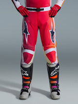 Alpinestars 2026 Racer Portl Pants, Motocross Pants, Red Light Gray and Dark Gray, worn with matching red gloves and multicolored boots, featuring bold Alpinestars star logos on the thighs and white accents, sporty design for off-road racing