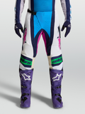 Pantalon Alpinestars Techstar Maven, pantalon de motocross bleu et blanc avec accents roses, soufflets de genoux Babel, vue de face