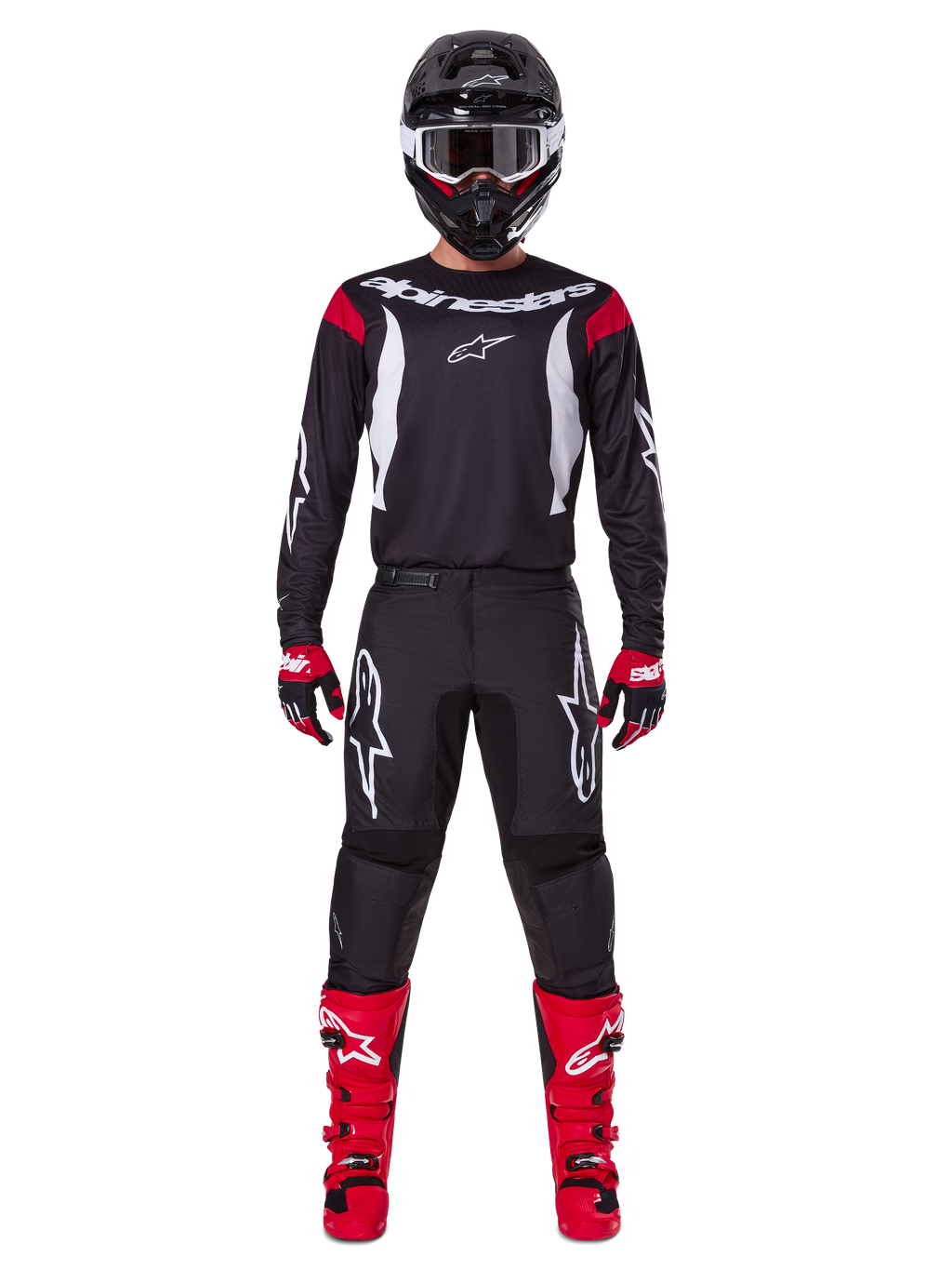 Ensemble d'équipement Alpinestars 2025 Fluid Haul, pilote de motocross en tenue de course complète, maillot noir avec accents rouges aux épaules et logos blancs, pantalon noir avec logo étoile blanc, bottes rouge vif, gants rouges et noirs, casque noir avec lunettes blanches, look de performance tout-terrain coordonné